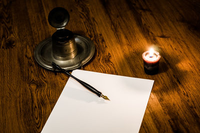 High angle view of paper on table