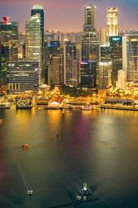 Illuminated buildings in water