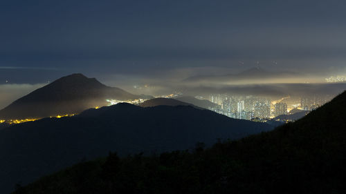 Scenic view of silhouette mountains against sky at sunset