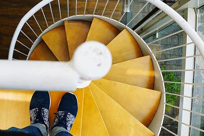 Low section of person standing on staircase