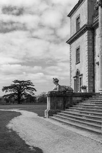 Statue of building against cloudy sky