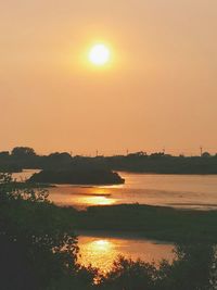 Scenic view of sea at sunset