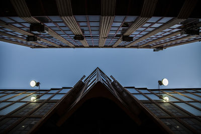 Low angle view of illuminated built structure against sky