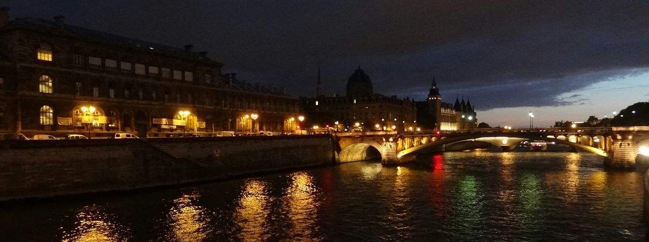 architecture, built structure, water, illuminated, building exterior, connection, river, waterfront, reflection, bridge - man made structure, city, sky, arch bridge, night, bridge, canal, transportation, sunset, travel destinations, outdoors