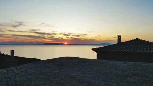 Scenic view of sea against sky at sunset