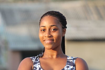 Portrait of young woman standing outdoors