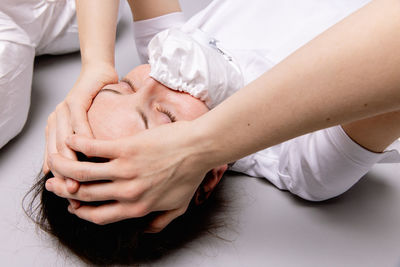 Midsection of doctor examining patient