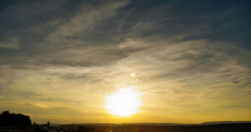 Scenic view of dramatic sky during sunset