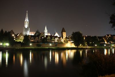 Reflection of illuminated buildings in water at night