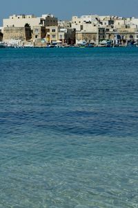 View of sea with buildings in background