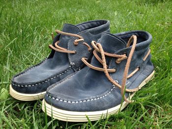 High angle view of shoes on field