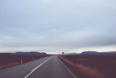 Road amidst landscape against sky