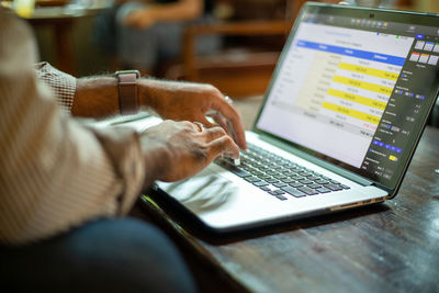 Man using laptop on table