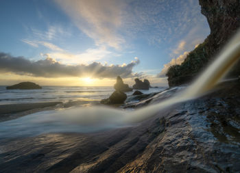 Scenic view of sea against sky during sunset