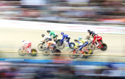 Blurred motion of people riding bicycle