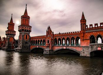 View of bridge over river in city