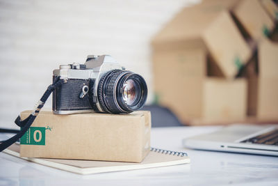 Close-up of camera on table