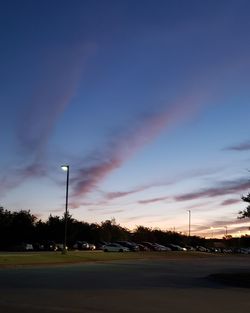 Street against sky at sunset