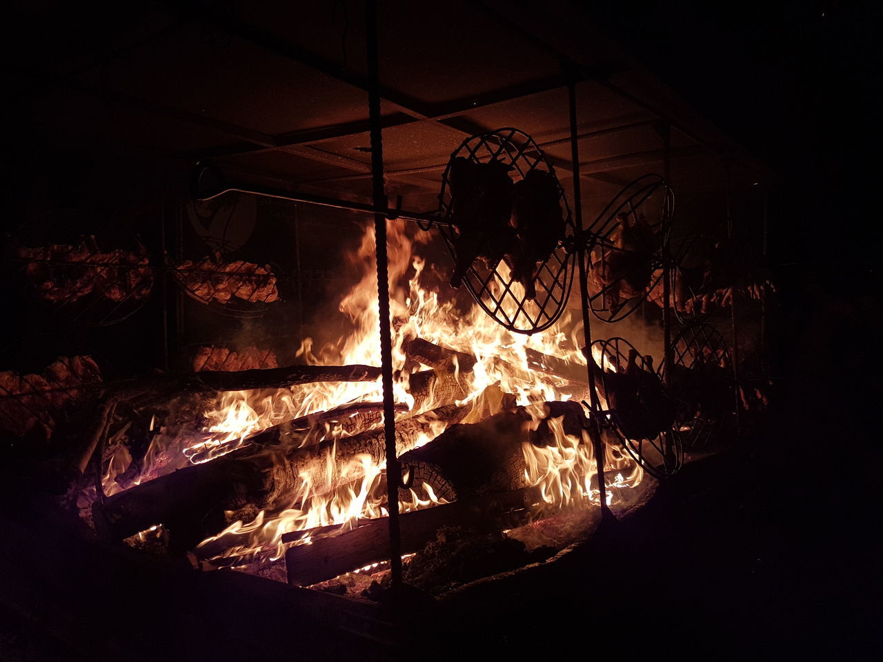 burning, heat - temperature, fire, flame, fire - natural phenomenon, nature, night, wood, log, real people, glowing, occupation, firewood, indoors, wood - material, motion, dark