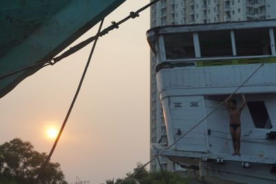 Low angle view of boat against sky during sunset