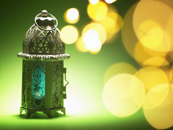 Close-up of small lantern on table