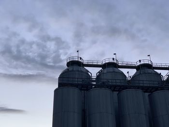 Low angle view of factory against sky