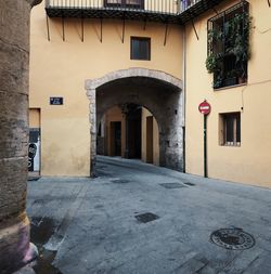 Alley amidst buildings in city