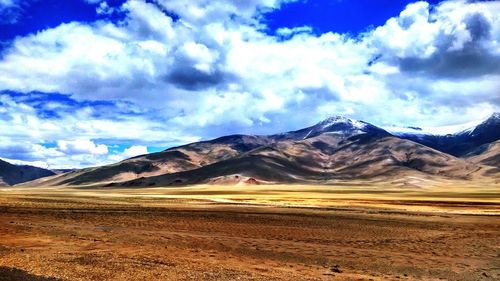 View of landscape against cloudy sky