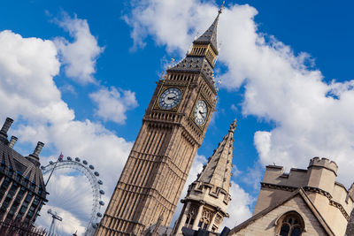 Low angle view of big ben and buildings against sky