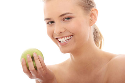 Portrait of a smiling young woman over white background