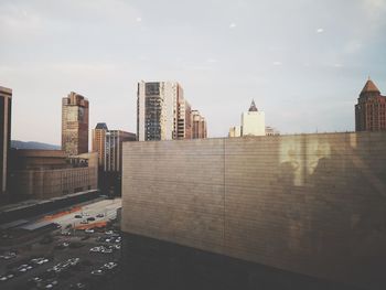 Modern buildings in city against sky