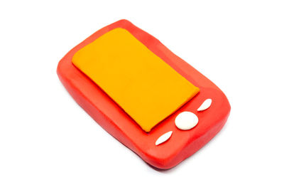 High angle view of red box over white background