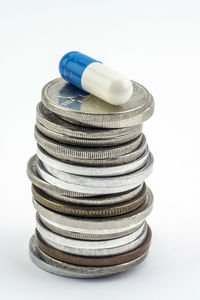 Close-up of coins on white background