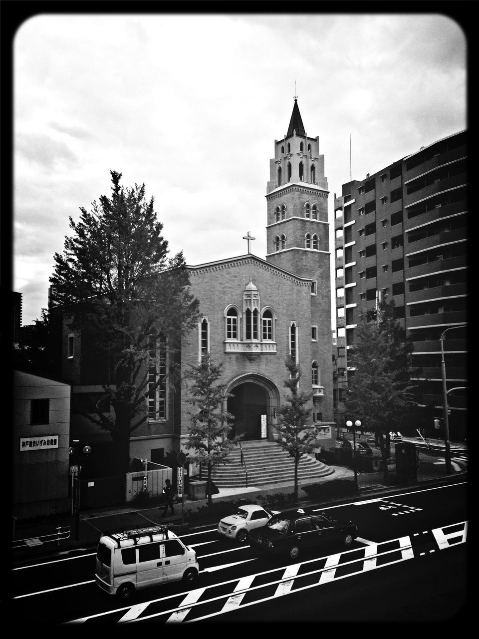 building exterior, architecture, built structure, transfer print, sky, auto post production filter, city, tree, low angle view, street, car, tower, cloud - sky, clock tower, building, cloud, outdoors, church, day, city life