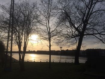 Scenic view of lake at sunset