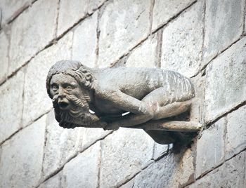 Low angle view of gargoyle statue on wall