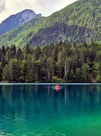 Scenic view of lake and mountains against sky