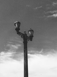 Low angle view of floodlight against sky