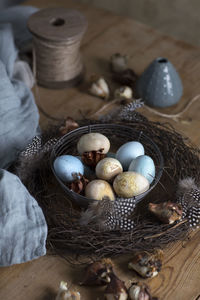 High angle view of eggs in basket on table