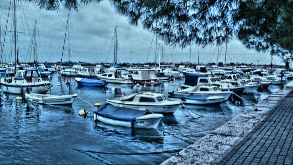 moored, nautical vessel, water, boat, transportation, mode of transport, harbor, sky, reflection, sea, in a row, marina, day, no people, nature, outdoors, cloud - sky, sailboat, tranquility, lake