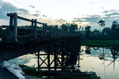 Built structure by trees against sky