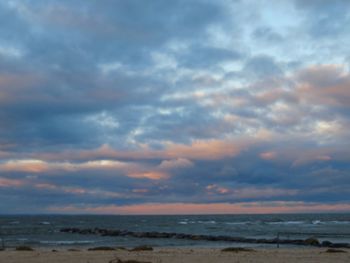 Scenic view of sea against dramatic sky