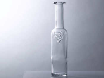 Empty bottle or container on the gray background