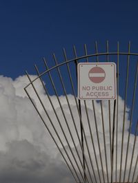 Information sign against blue sky