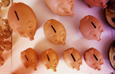 Directly above shot of piggy banks on table