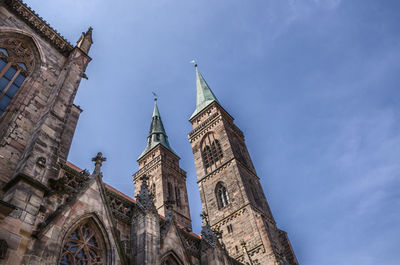 Low angle view of traditional building against blue sky