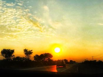 Road against sky during sunset