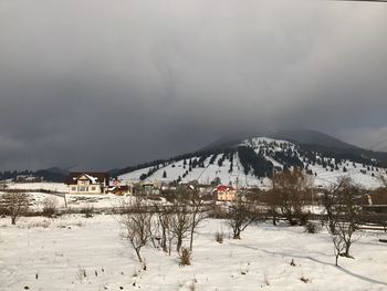 Scenic view of snow covered mountain against sky