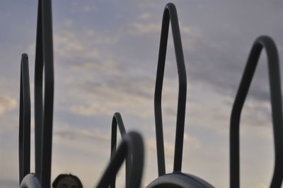Close-up of cropped object against sky at sunset
