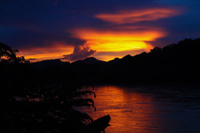 Scenic view of lake against romantic sky at sunset